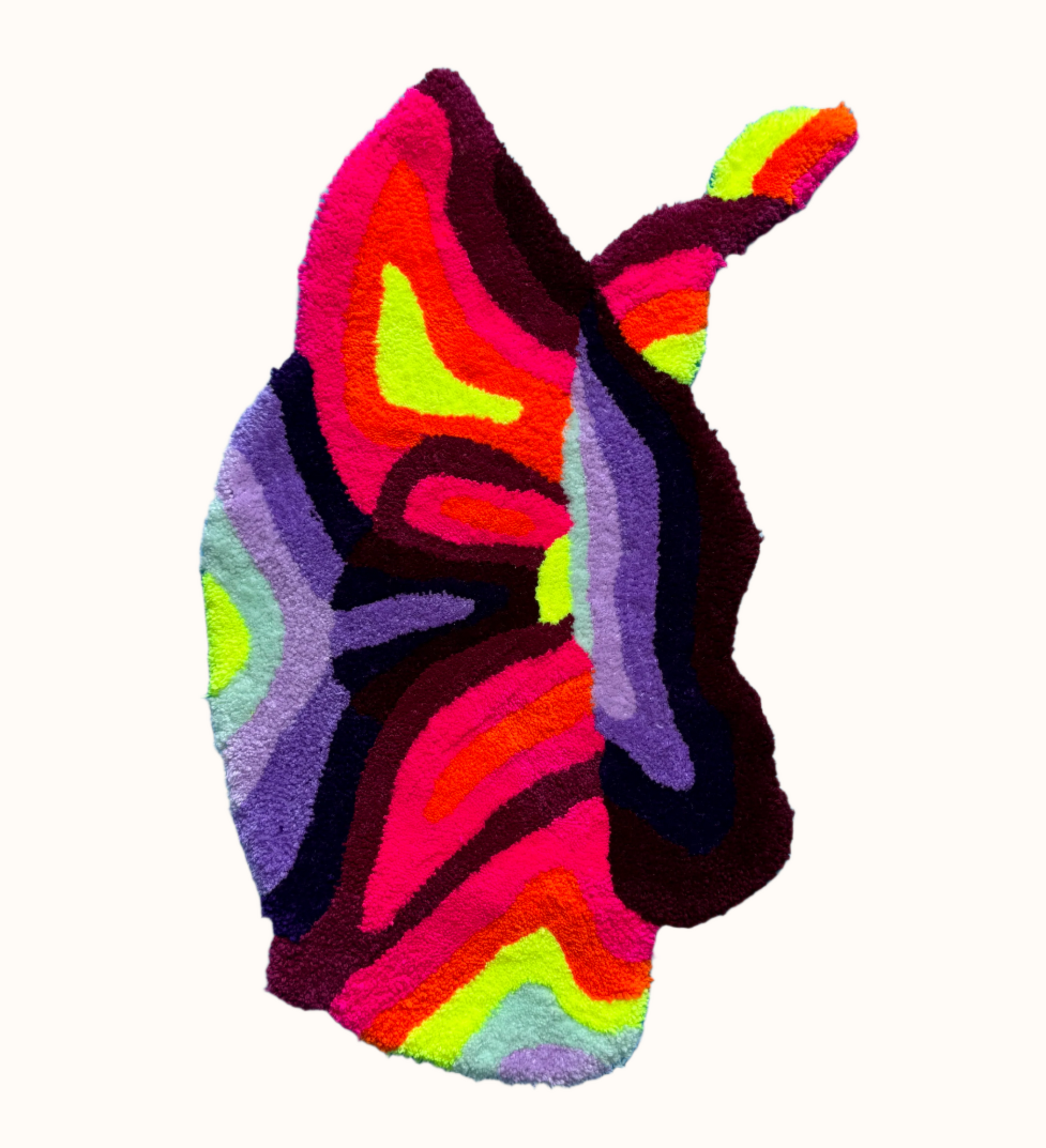 Colorful orquid-shaped rug on a light blue background