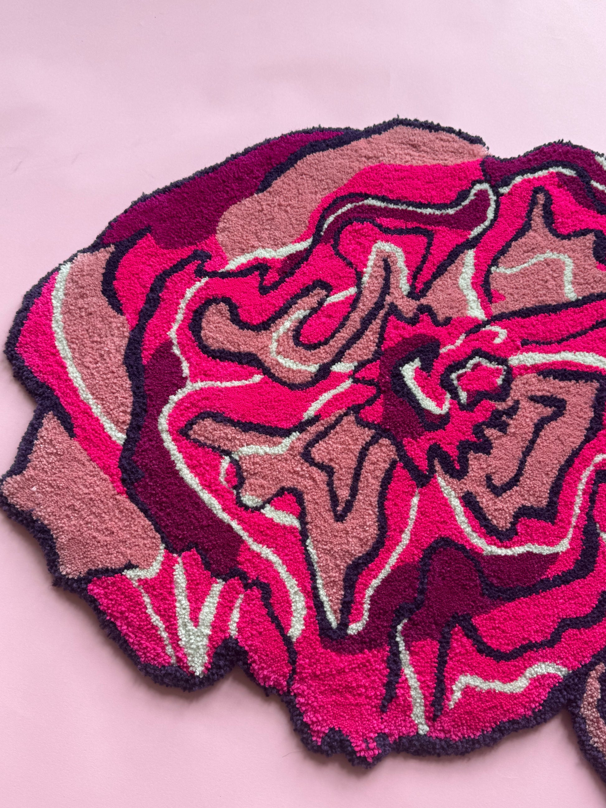 Pink floral rug on a pink background