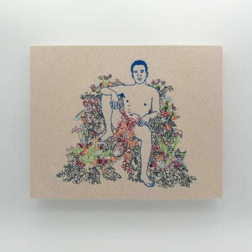 Azul: embroidered figure outlined in royal blue, seated with one knee up among flowers, on natural canvas