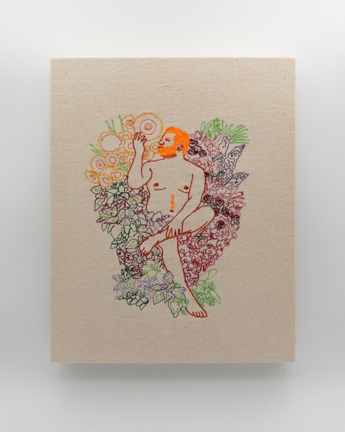 Robin: embroidered figure with an orange beard, hand raised, surrounded by flowers, on natural canvas